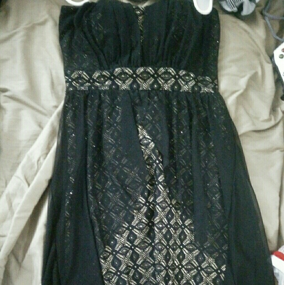 Back and gold dress
